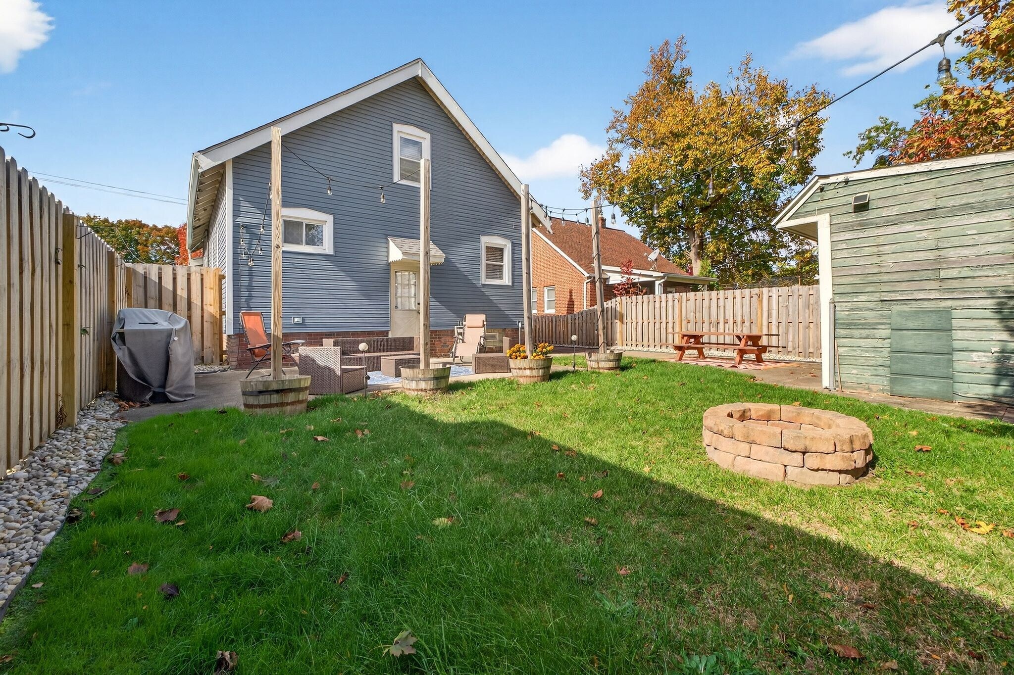 Backyard with Fenced in Yard and String Lights - 4429 S Hills Dr