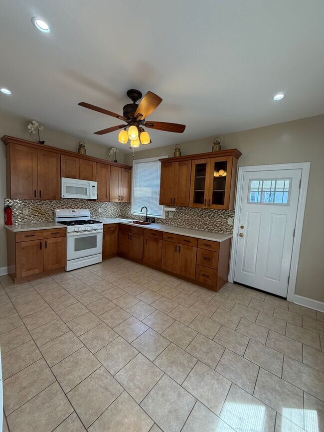Building Photo - Spacious 3 Bedroom Home – Backyard + Porch Included!