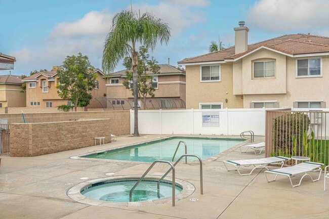 Building Photo - Gated Townhome with Updated Kitchen and Private Backyard