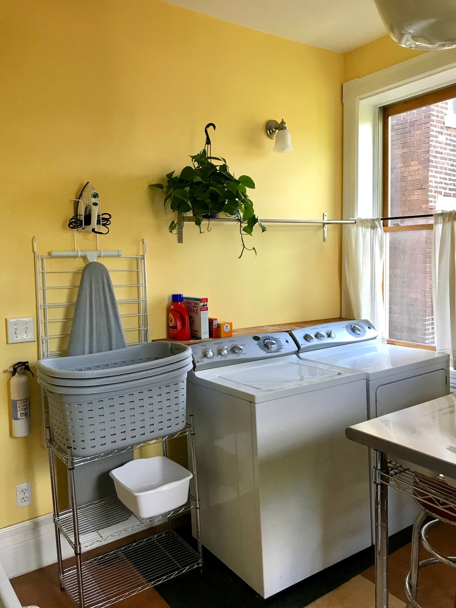 Laundry includes high efficiency washer, dryer, ironing board, iron, laundry baskets, drying rack, wash basin, and clothespins. - 3284 Dawson Street
