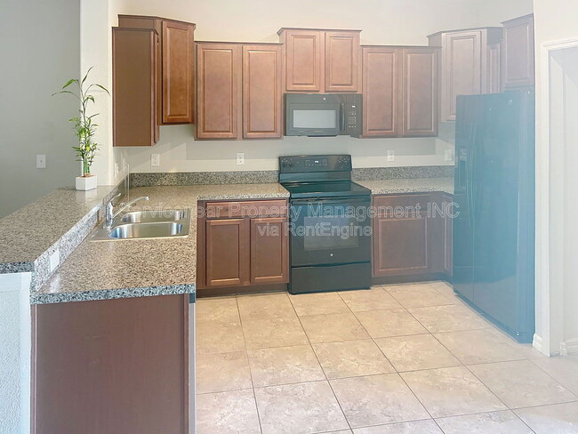 Building Photo - 7648 Ginger Lily Ct