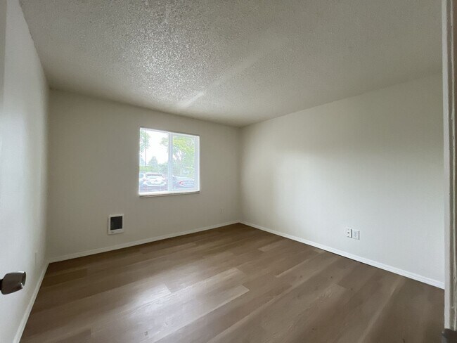 Building Photo - Inviting 2 Bedroom Home with Open Layout, Stainless Steel Appliances & Private Outdoor Retreat
