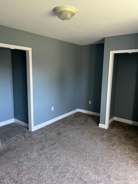 Bedroom 1 featuring 2 closets - 53314 Zachary Dr