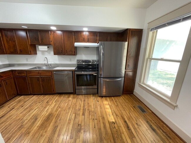 Building Photo - New Appliances + HUGE Fenced Backyard