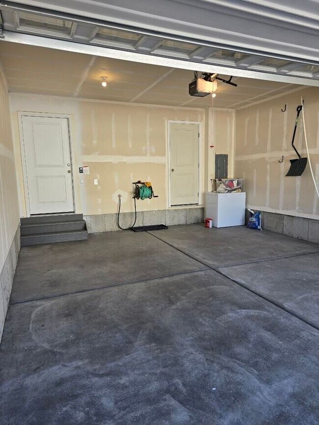 Building Photo - Nearly New, Well Appointed Modern Townhouse w 2 car attached garage