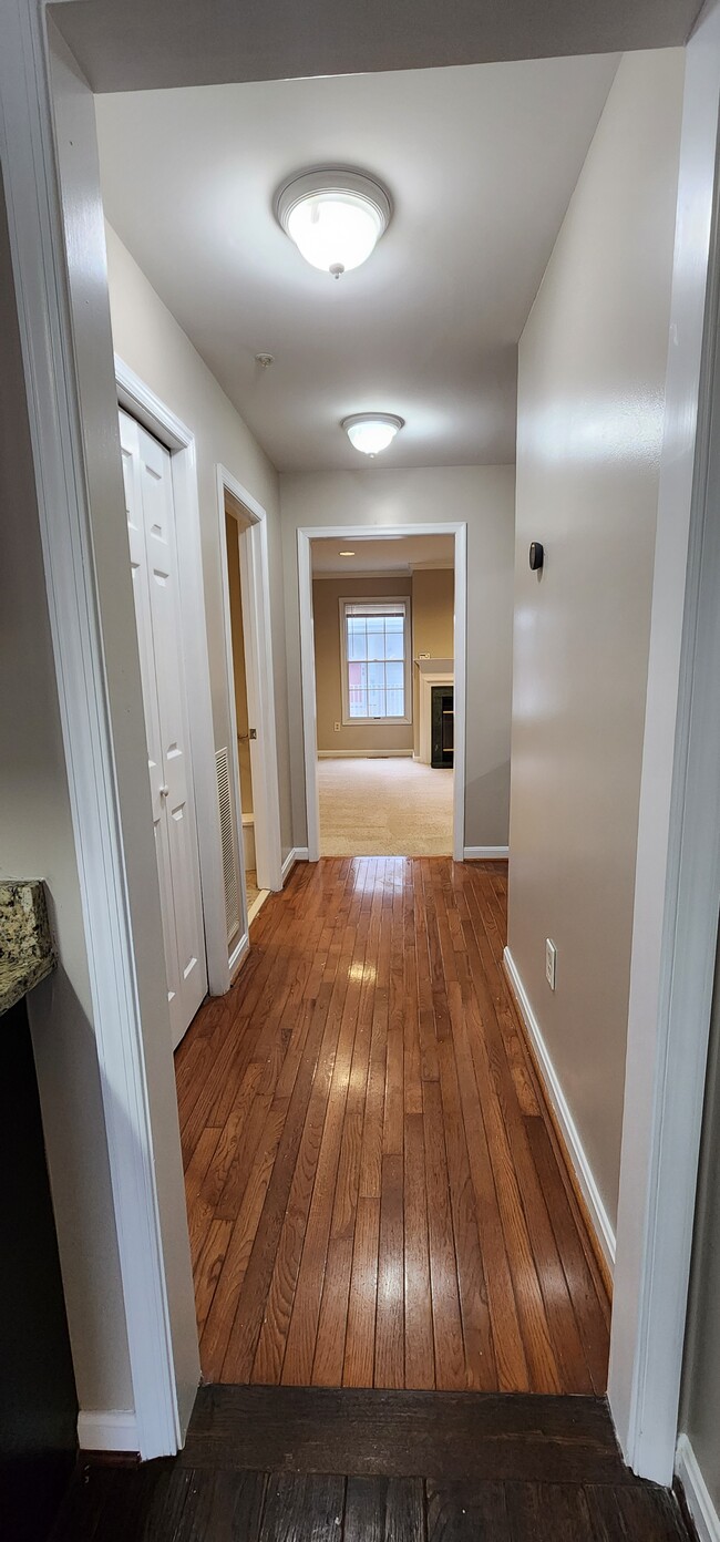 Hallway connecting the kitchen and family room - 13 Steeple Ct