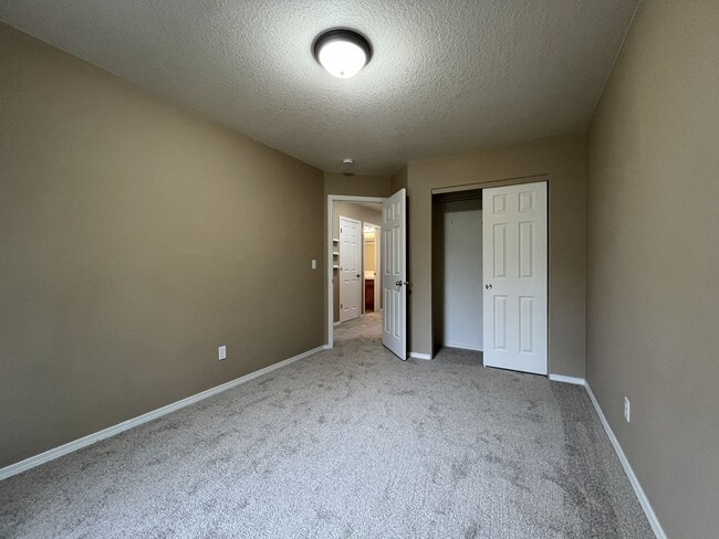 Building Photo - Inviting Two-Story 3BR Home Featuring New Carpet, New Stainless Appliances, Spacious Garage Stora...