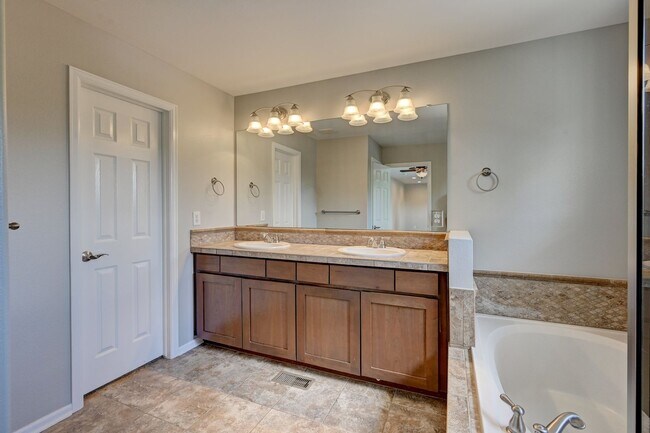 Building Photo - 5 bedroom, 4 bath home with 2 car attached garage