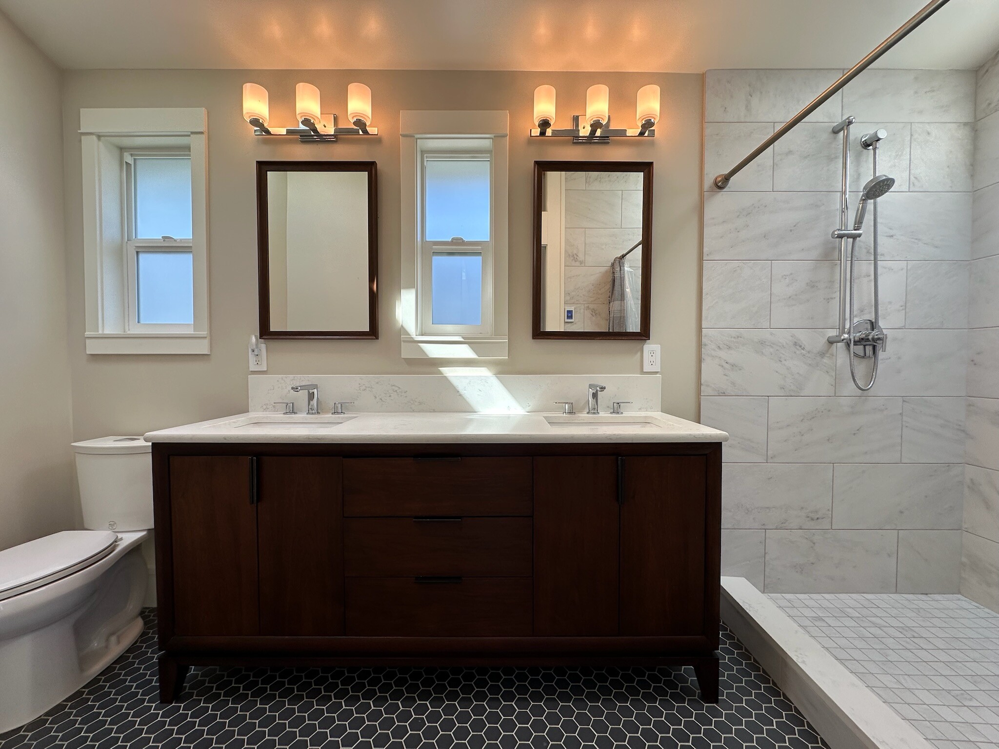 Primary suite bathroom w/ double vanity - 211 W Boston St