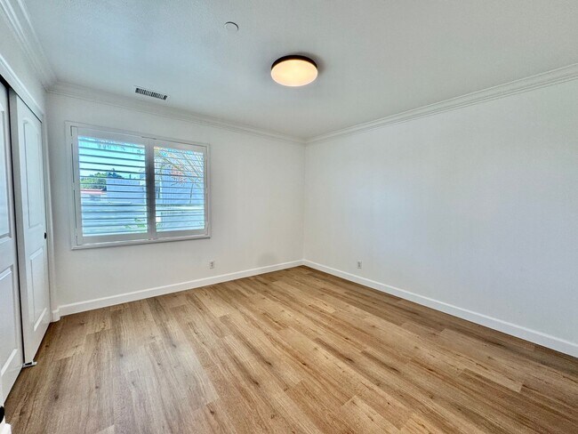 Building Photo - Beautifully Remodel Townhouse with AC & Two Car Garage!