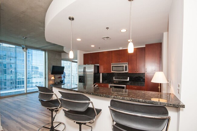Building Photo - For Rent: Stunning 17th Floor Views of Dow...