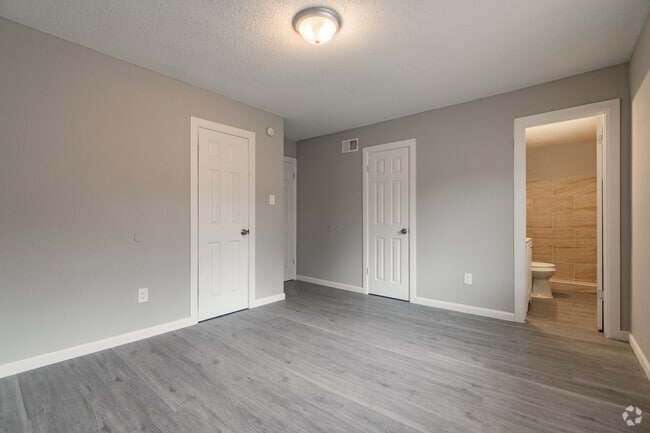 3BR, 2BA - 1100SF - Primary Bedroom - Camelot Manor