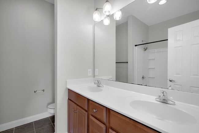 Building Photo - Wonderful craftsman style end-unit townhome