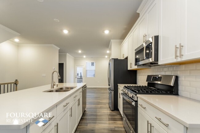 Building Photo - Modern 3-Story Townhome with First-Level B...