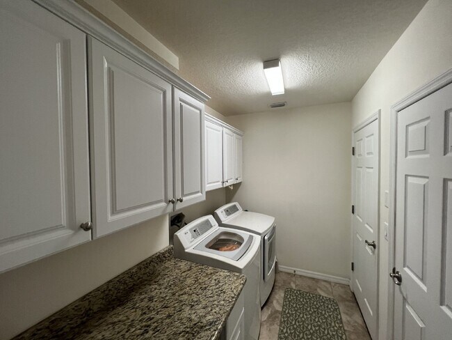 Building Photo - "Spacious 4-Bedroom Lutz Home with Elegant...