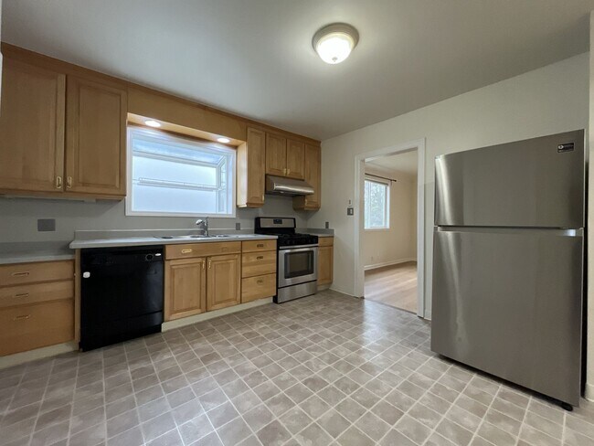 Building Photo - Character-Filled Concordia Home with Flexible Living Spaces & Gas Fireplace