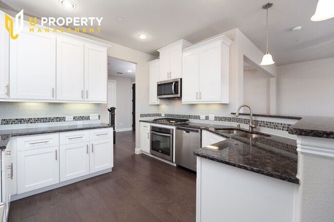 Building Photo - Luxury Townhome- wood flooring. Great location