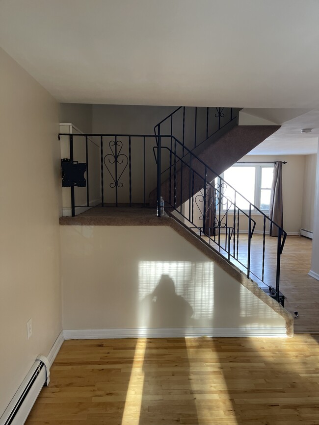 Stairs to third floor from living room - 36 Tenney Rd