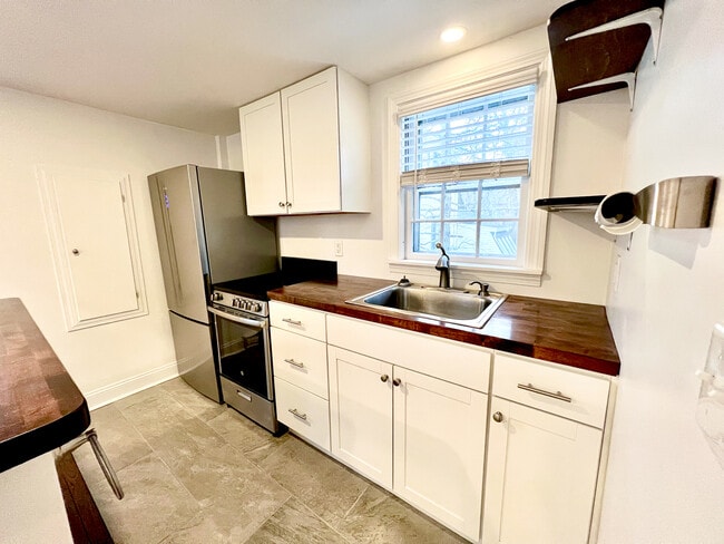 Kitchen featuring new appliances and built-in cabinets - 21 Washington St