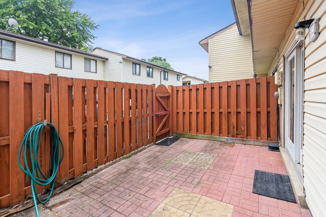 Rear fenced-in patio off kitchen! - 8407 Alameda Ct