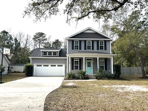 Building Photo - Enjoy private living in this beautiful 3 bedroom, 2.5 bathroom home on almost half acre lot!