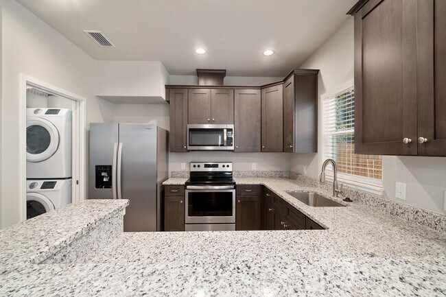 Building Photo - The Reef Townhome NOW LEASING FOR FALL 2026!