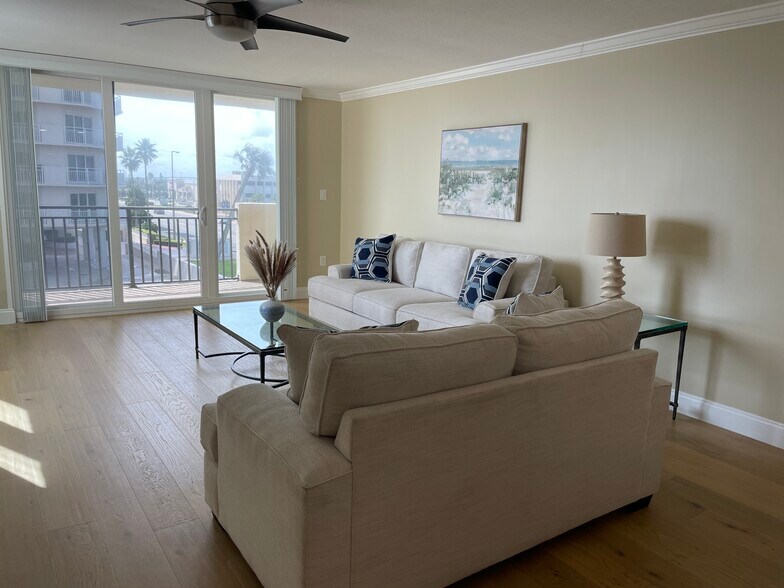 Main room - includes flat screen TV on wall opposite couch - 2947 S Atlantic Ave