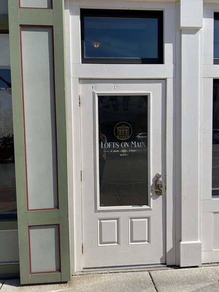 Front door featuring keyless entry. - 104 S Main