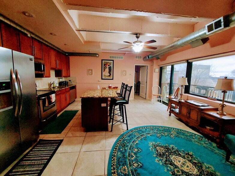 Full view of the galley kitchen and living room area - 2940 Baltimore Ave
