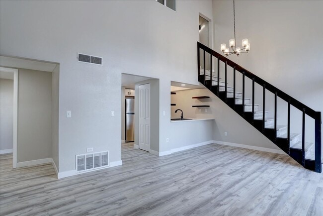 Building Photo - Stunning Top-Floor End Unit with Vaulted Ceilings and Modern Finishes