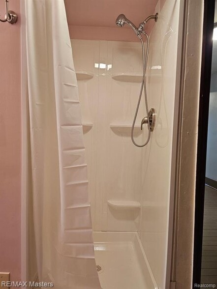 Bath features walk in shower. - 437 N Monroe St
