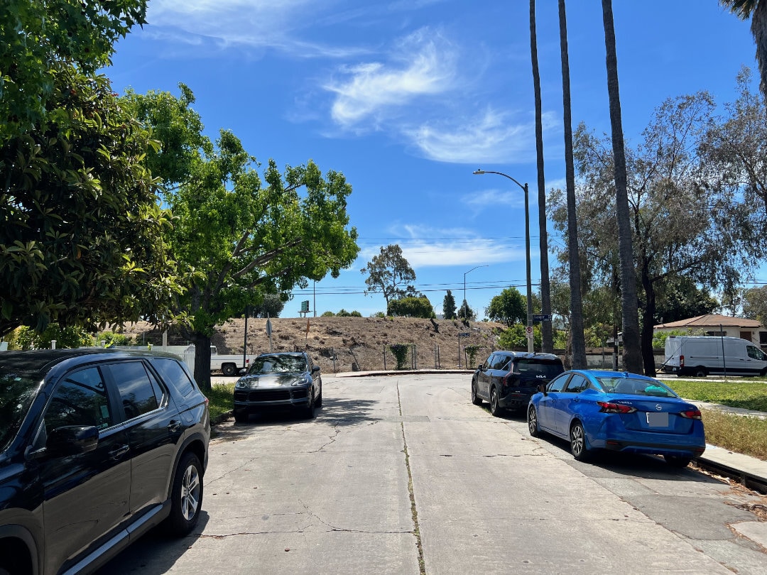 Street view facing south facing I-10 and home to left. - 2330 S Mansfield Ave