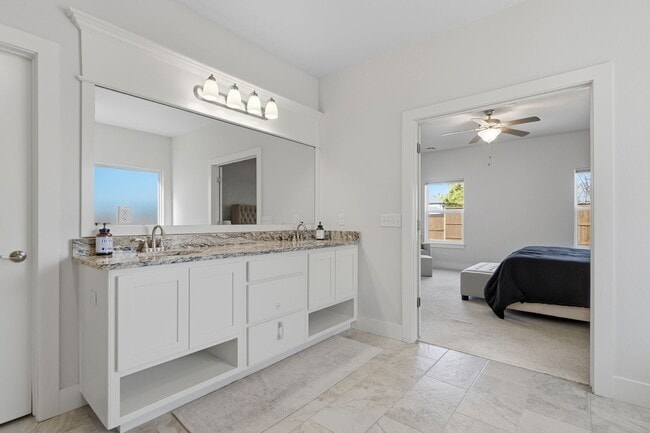 Building Photo - Stunner! This beautiful home features a spacious open floor plan with primary suite and private o...