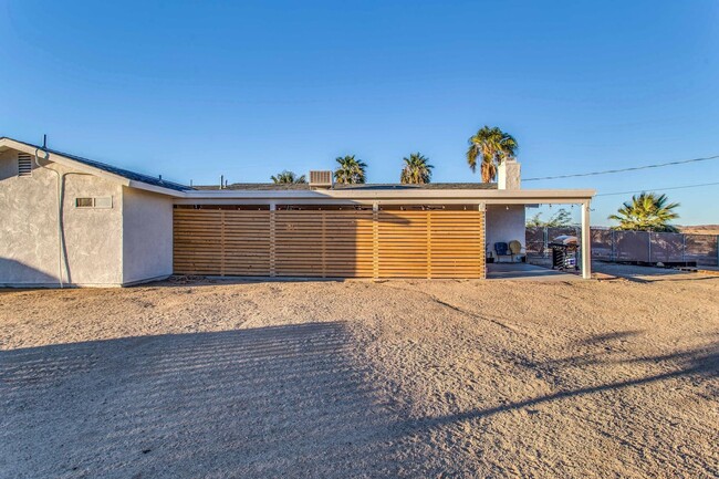 Building Photo - A Fully Furnished 3 Bedroom With Desert Mo...