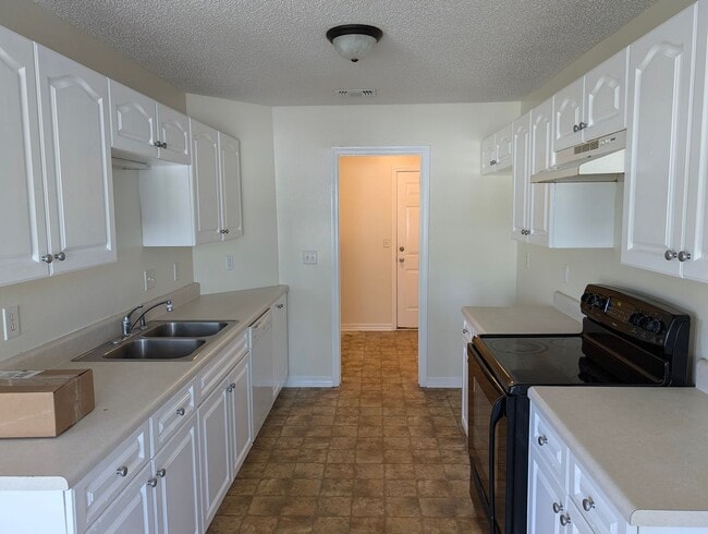 Building Photo - Updated 4-Bedroom Home on a Quiet Street — 1,695 sq ft, Large Garage — Now Accepting Applications