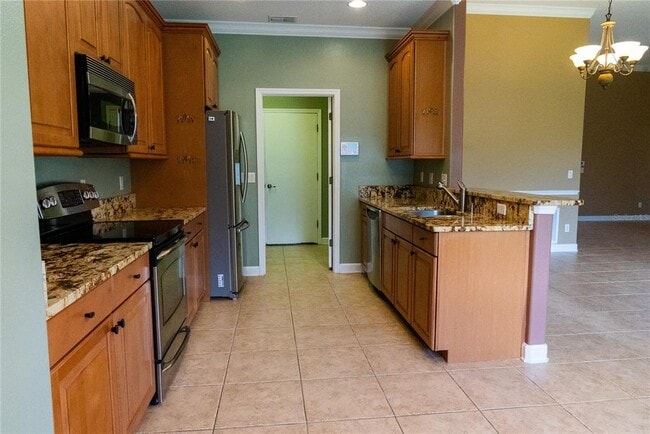 Building Photo - 5144 Legacy Oaks Dr
