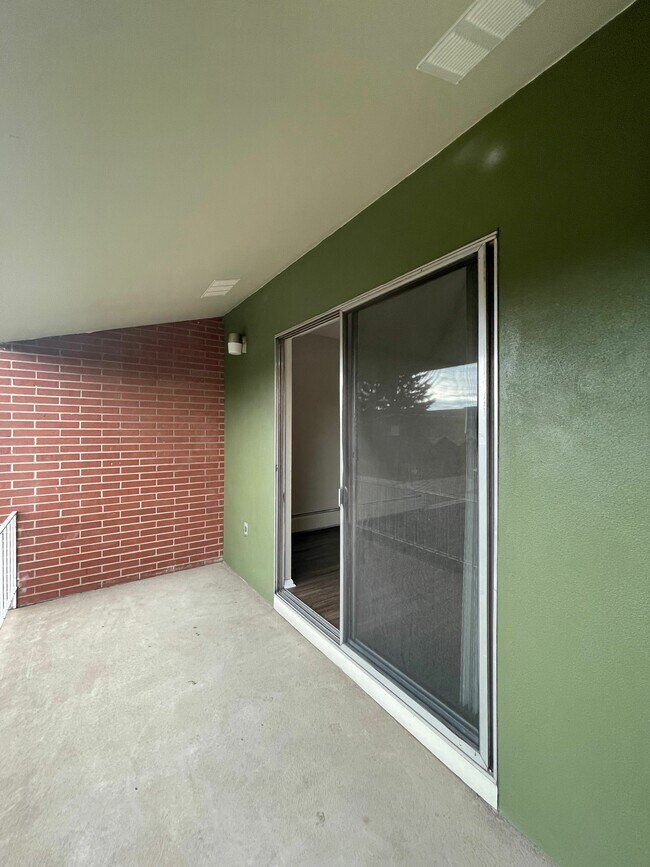 Step into your private outdoor oasis, ideal for enjoying fresh air and tranquility. - GRACE LANDINGS APARTMENTS