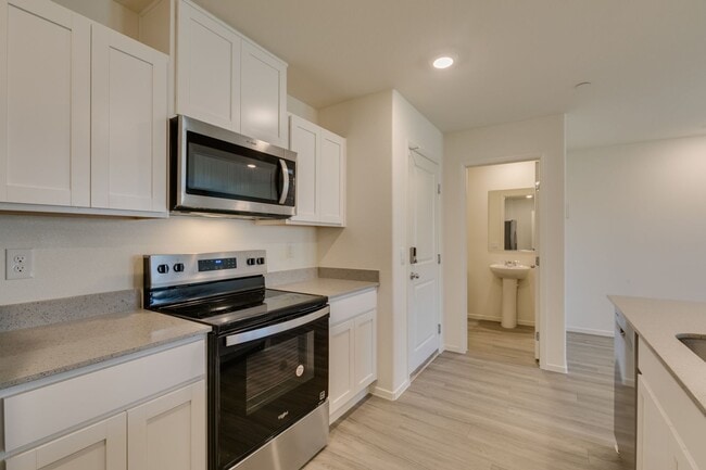 Building Photo - Gorgeous Townhome with upgrades in gated community* 3 large bedrooms, 2 car garage*Community pool...