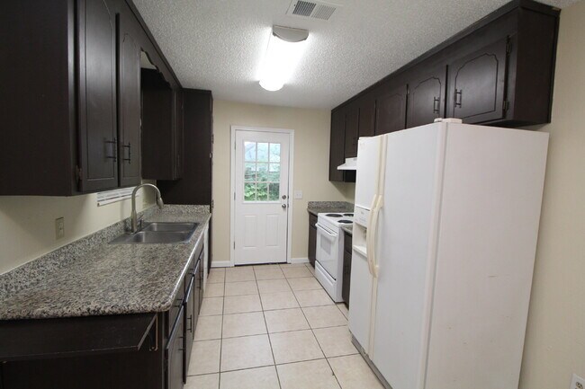 Building Photo - Bay Meadows 3BR Home Near NAS Pensacola with Granite Kitchen & Fenced Backyard