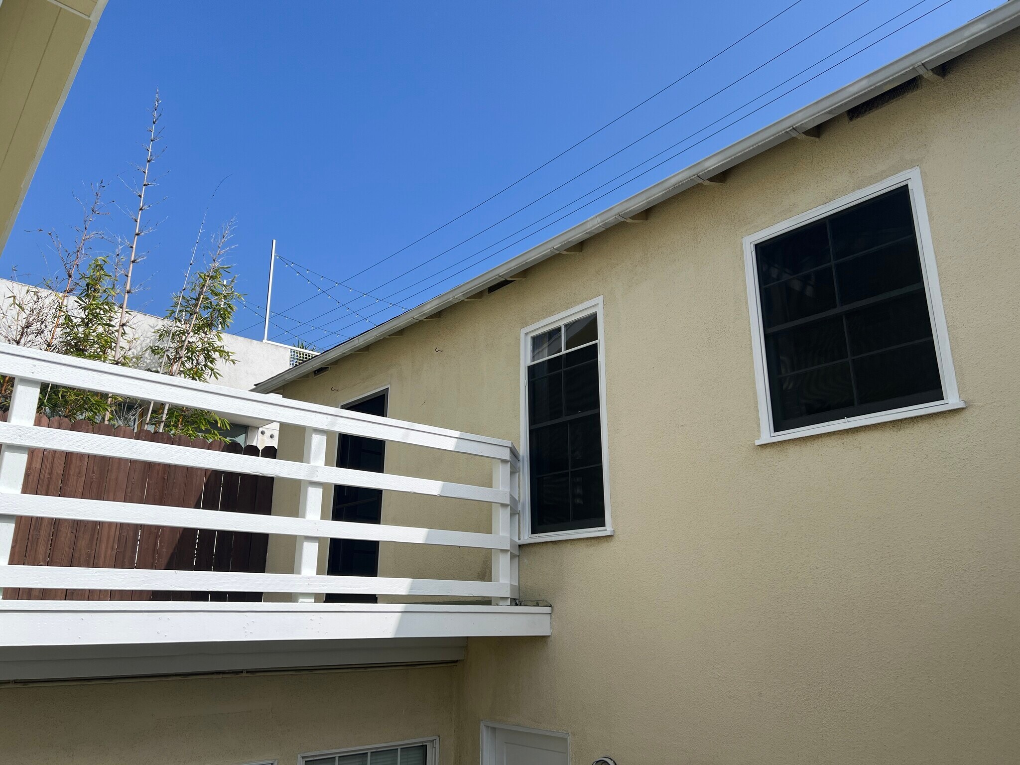 Private deck and west side of the unit. - 936 Palms Blvd