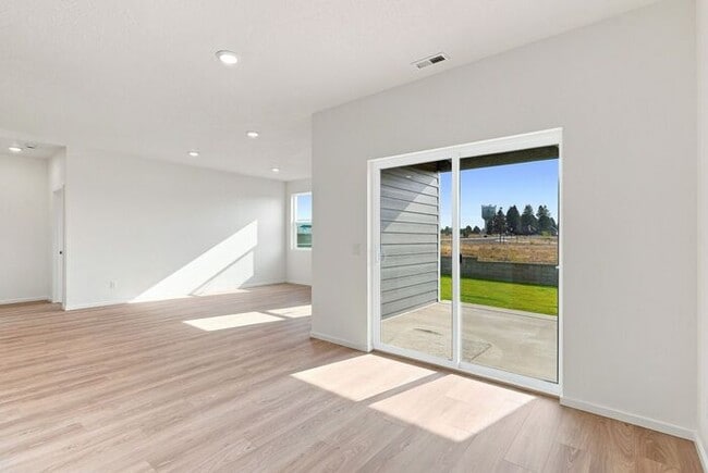 Building Photo - Modern 4-Bedroom Home with a 3-Car Garage & Covered Patio