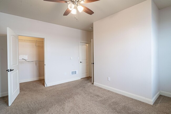 Bedroom 1 with walk in closet - 4100 Mullan Rd