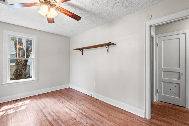 Building Photo - Charming 2BR/1BA Brick Cottage — Hardwoods, Fenced Yard, W/D Included