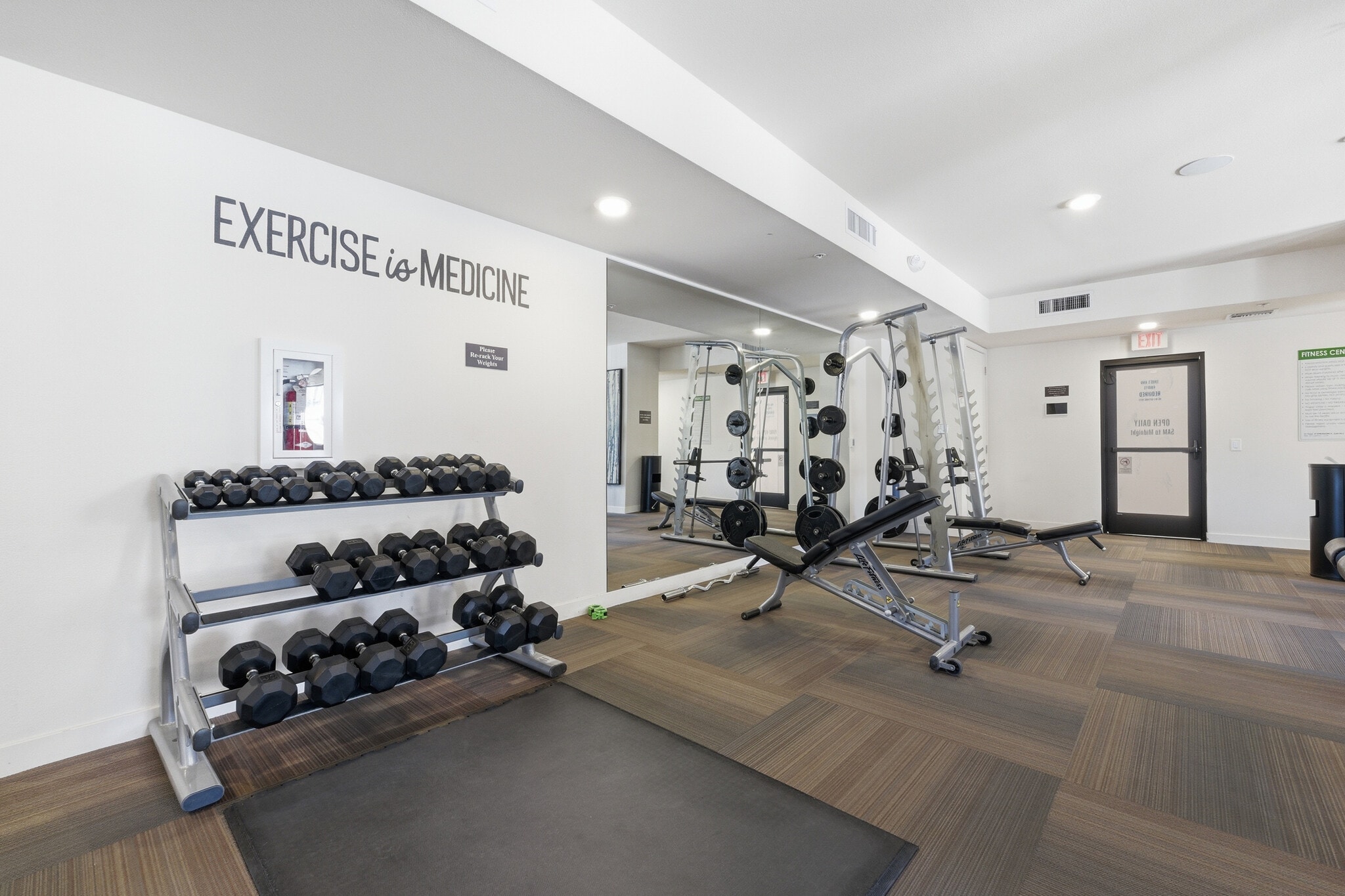 Modern fitness center featuring cardio, free weights, and strength equipment. - 2511 W Queen Creek Rd