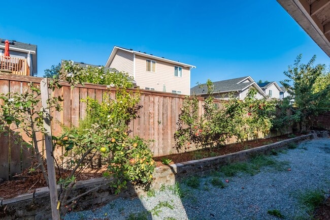 Building Photo - Spacious 4-Bedroom Home with Cozy Backyard...