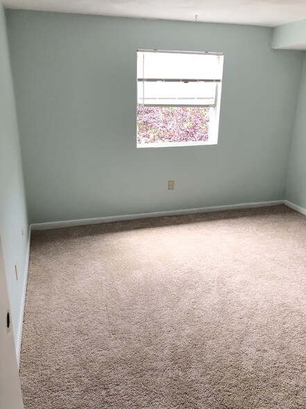 2nd bedroom view from door. Lots of light - 107 Oak Ln