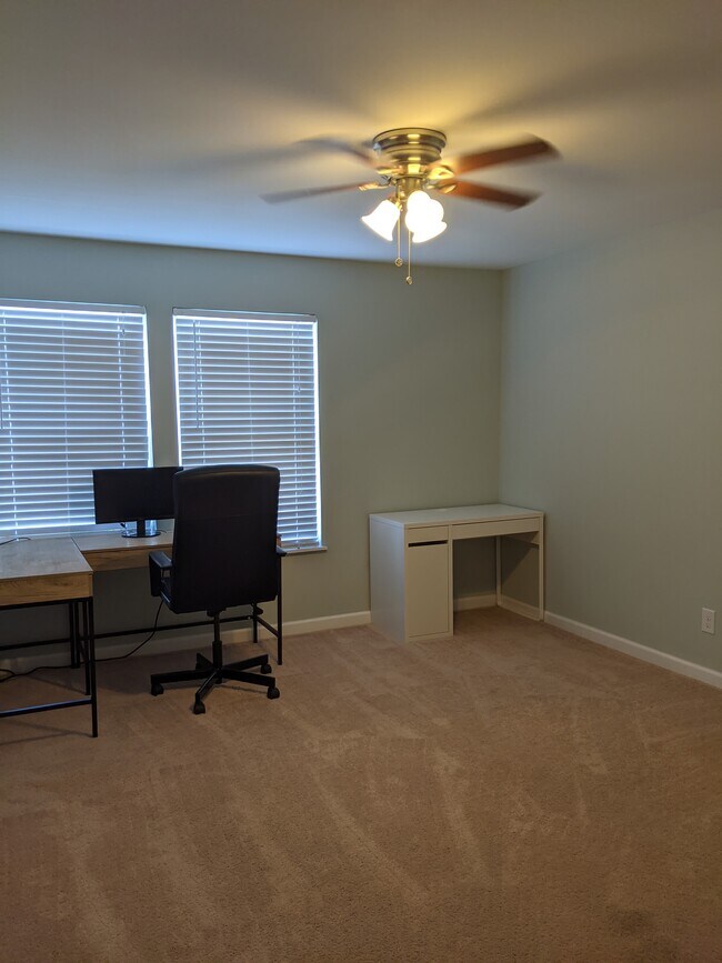First bedroom is decent sized and can fit plenty of furniture. - 2414 Lake Park Rd