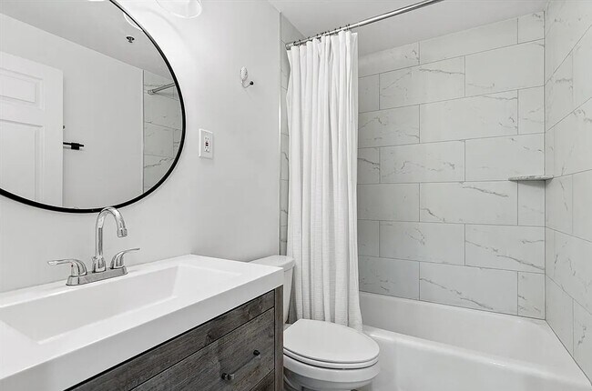 Building Photo - Sleek, Modern Unit Available Now