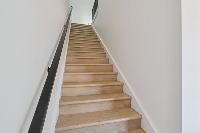 Building Photo - Bright. Clean. Calm. Your Elevated One-Bed...