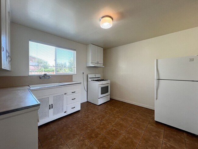 Building Photo - Charming 2 Bedroom, 1 Bathroom Home with Large Fenced Yard + Garage
